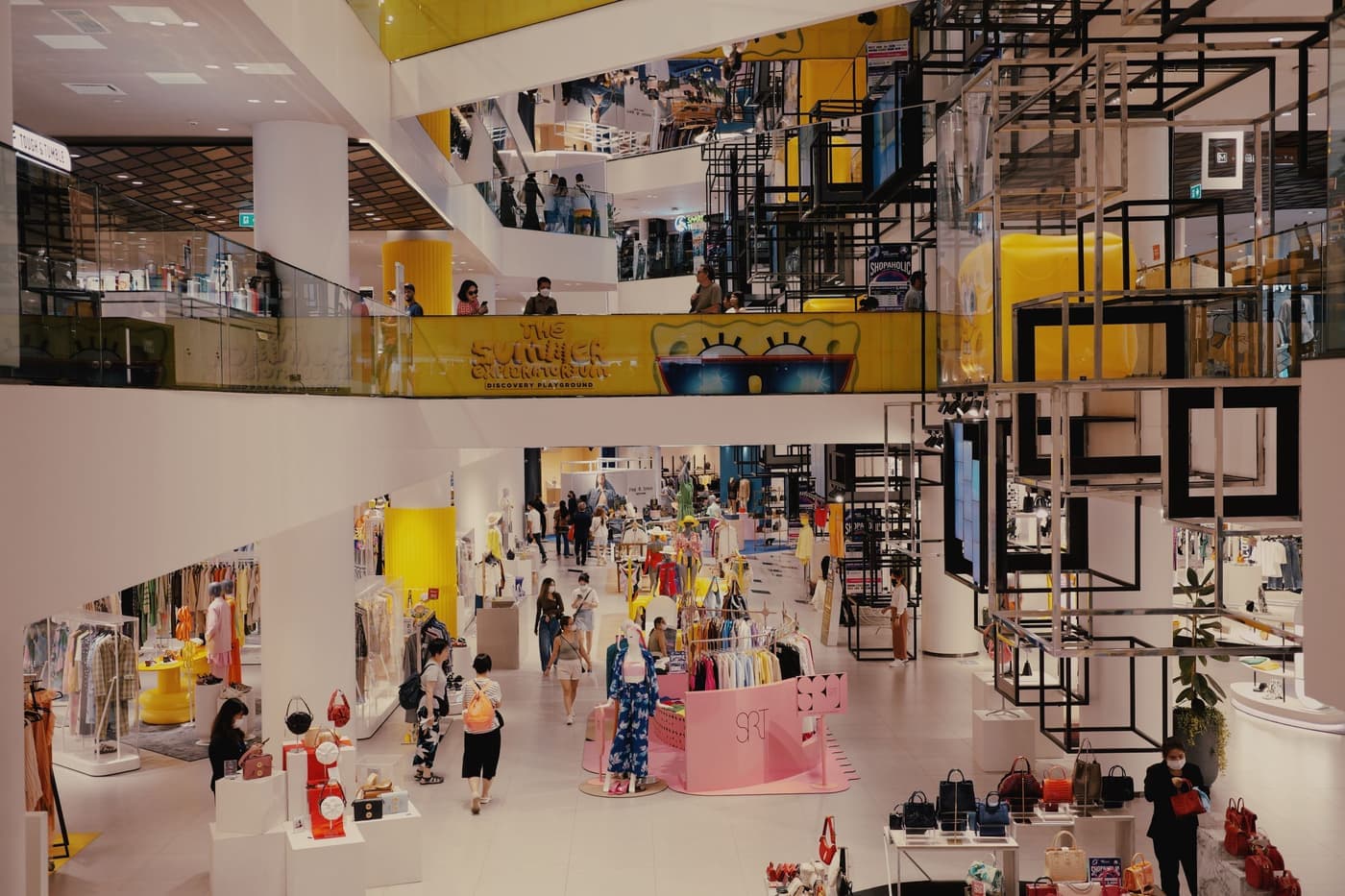A multi-level shopping center with fashion retailers