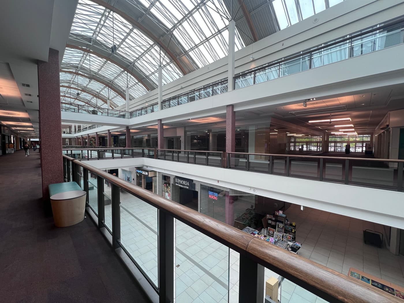 Interior of an enclosed shopping center with a skylit roof