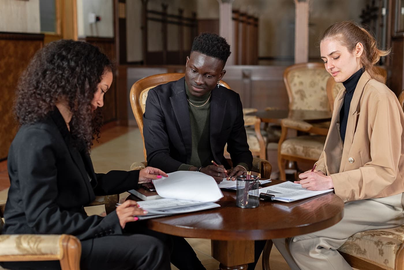 Colleagues reviewing lease documents together